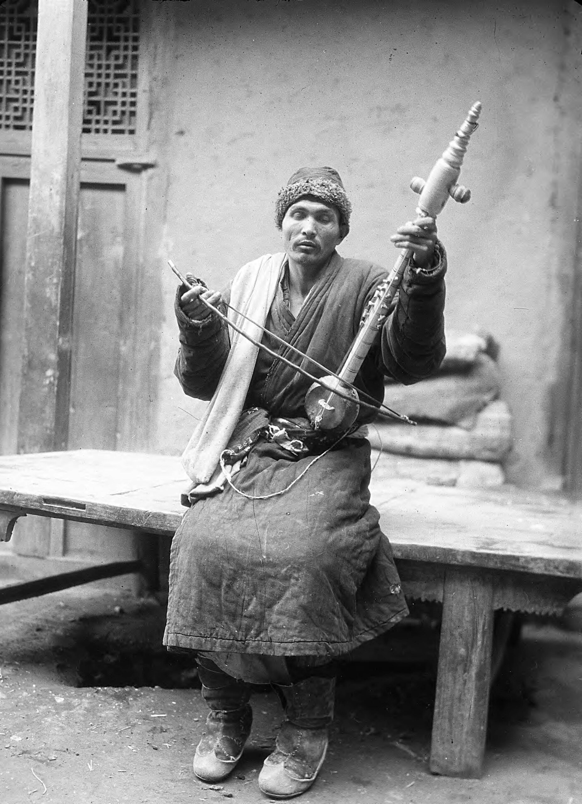 A musician in Xinjiang playing a stringed instrument. I think it’s