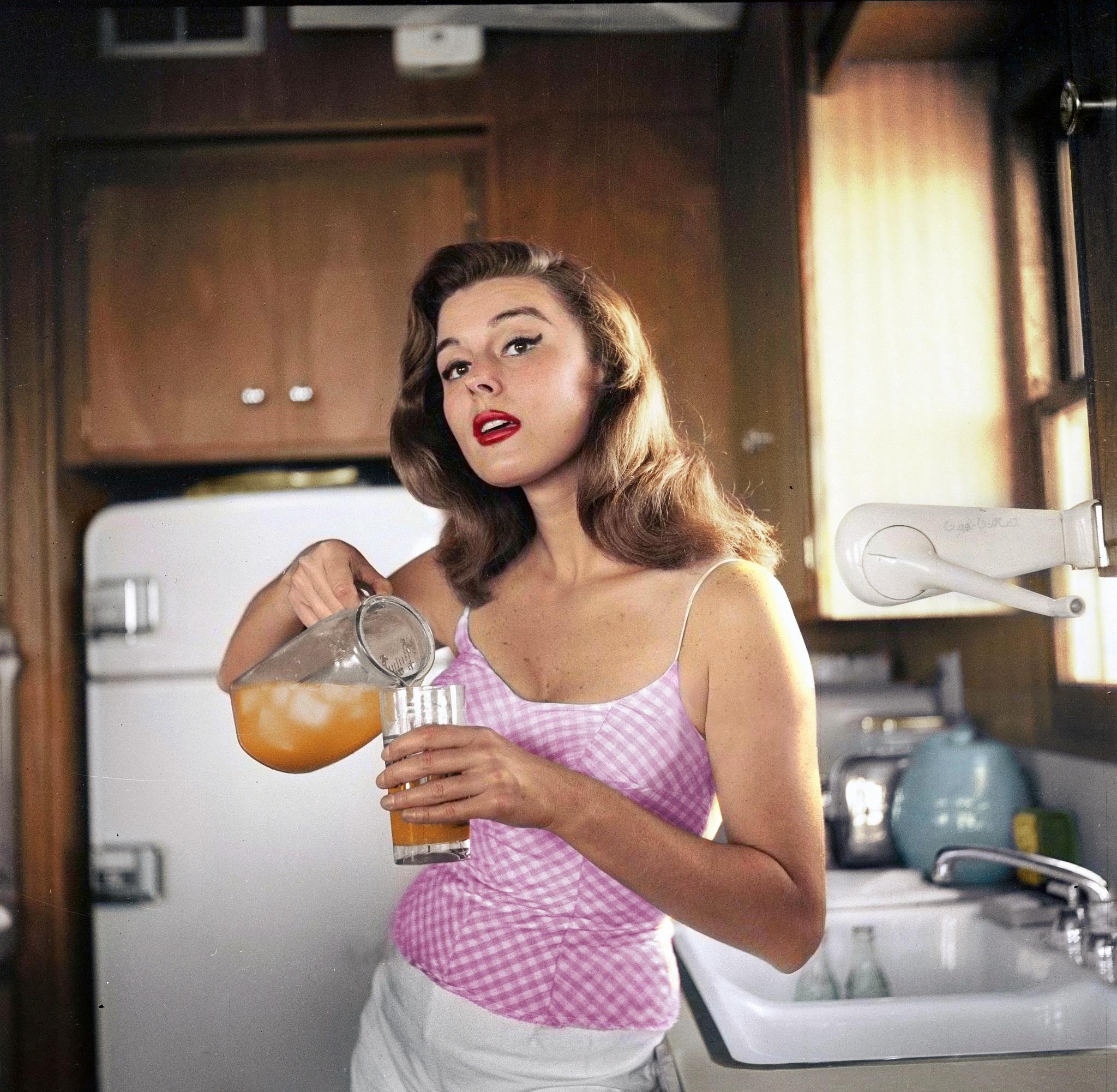 Actress Elaine Stewart poses at home in Los Angeles, CA 1957. Photo by