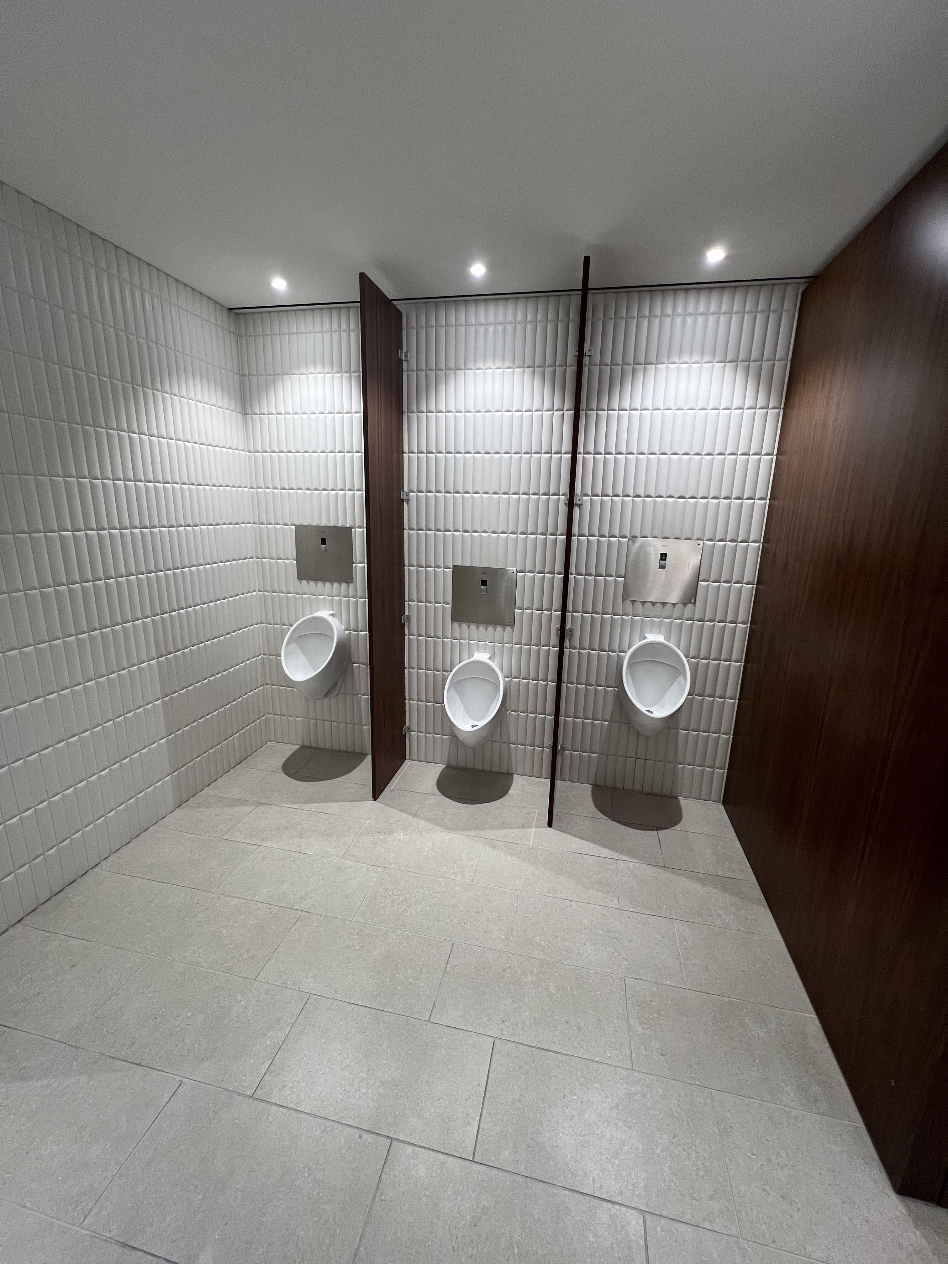 Bathroom designer understood urinal spacing, didn’t place lowered one
