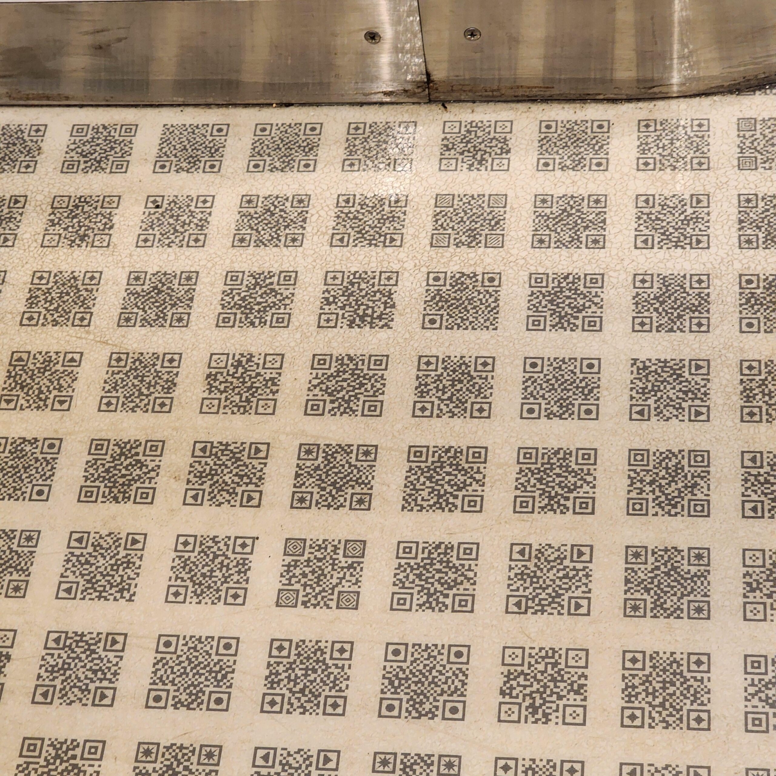 The floor on this Japanese train looks like QR codes. Pretty sure it ...